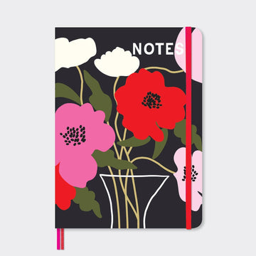 A5 Notebook - red, pink and white poppy like Florals and white lettering of the word NOTE and a red elastic strap