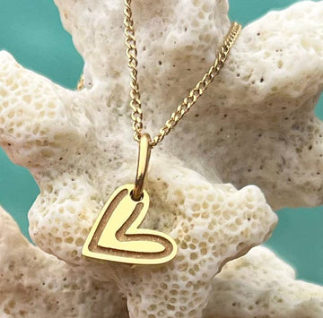 Gold heart charm necklace with engraved detail - Daisy Park